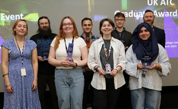 Group shot of all the winners posing with their awards.