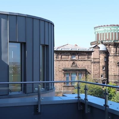 Image of the Royal Observatory Edinburgh with the HIggs Centre for Innovation in the forground.